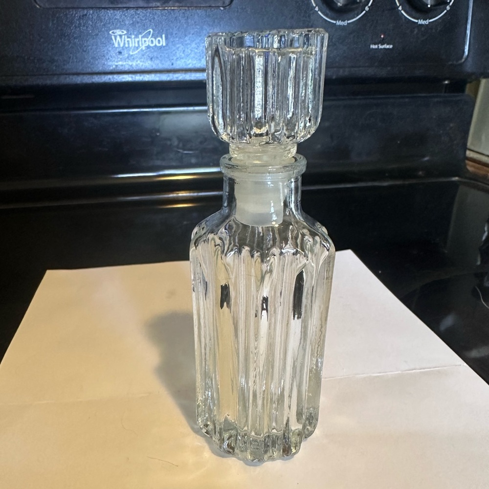 AVON, heavy crystal perfume bottle with matching stopper, no label.